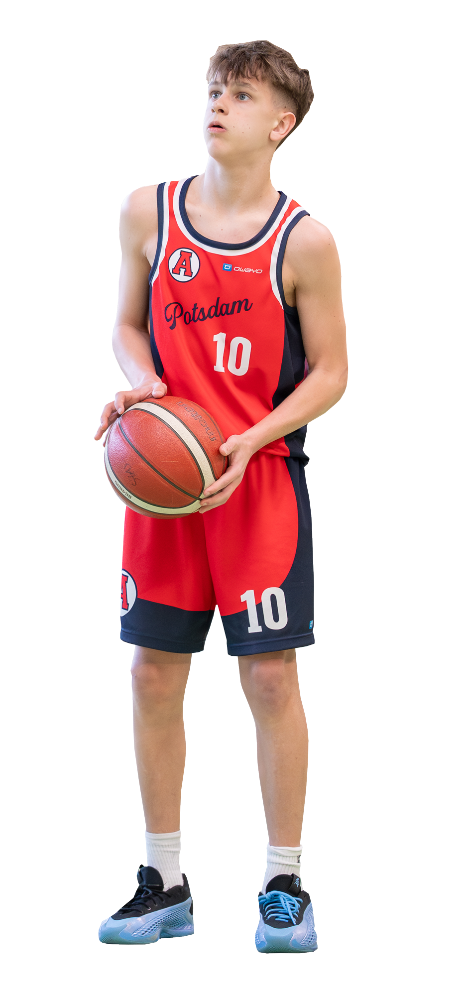 Ein Junge im Academytrikot mit Ball in der Hand